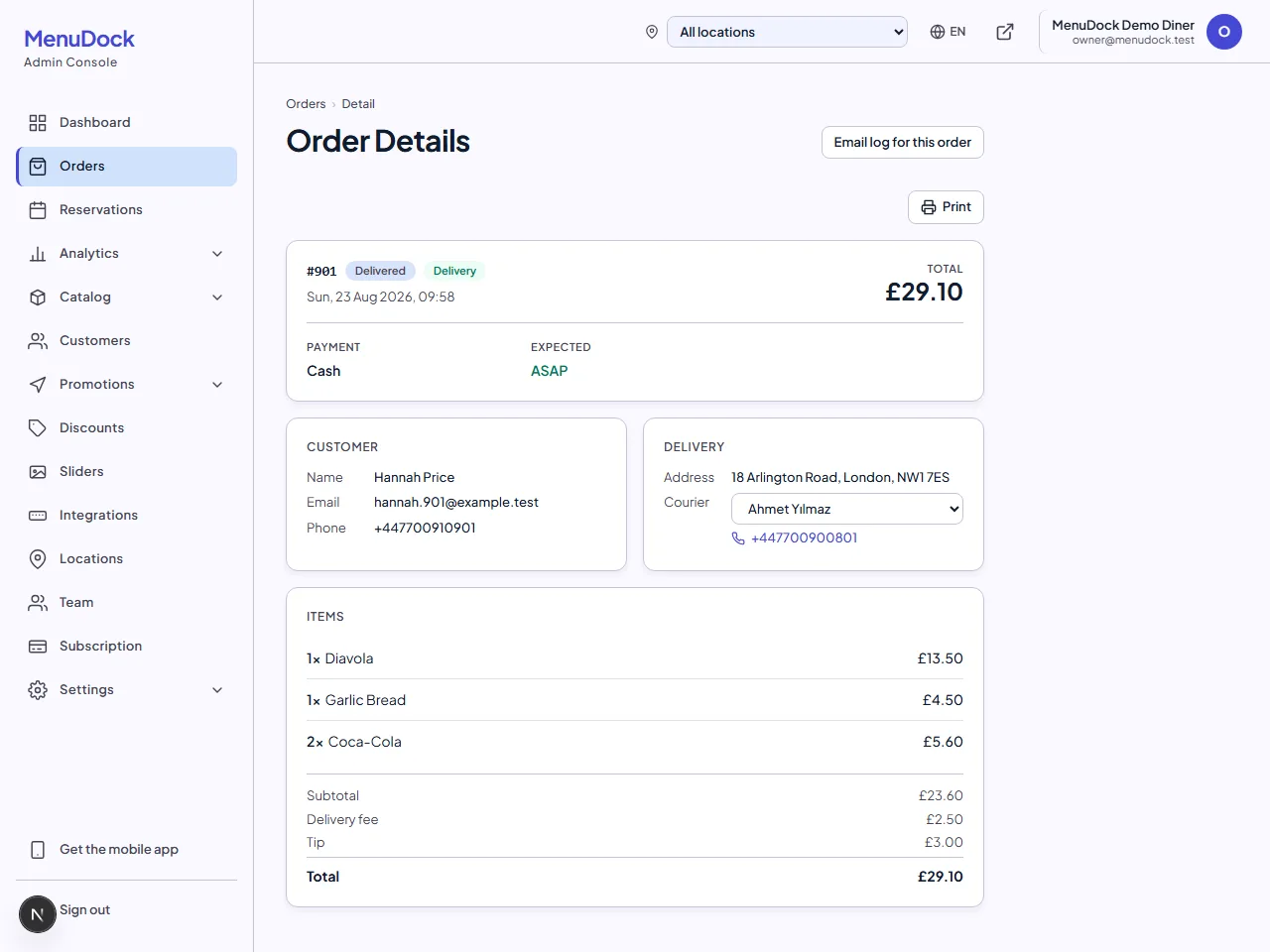 MenuDock admin order detail with the delivery card open, a courier chosen from the dropdown and their phone number beneath it